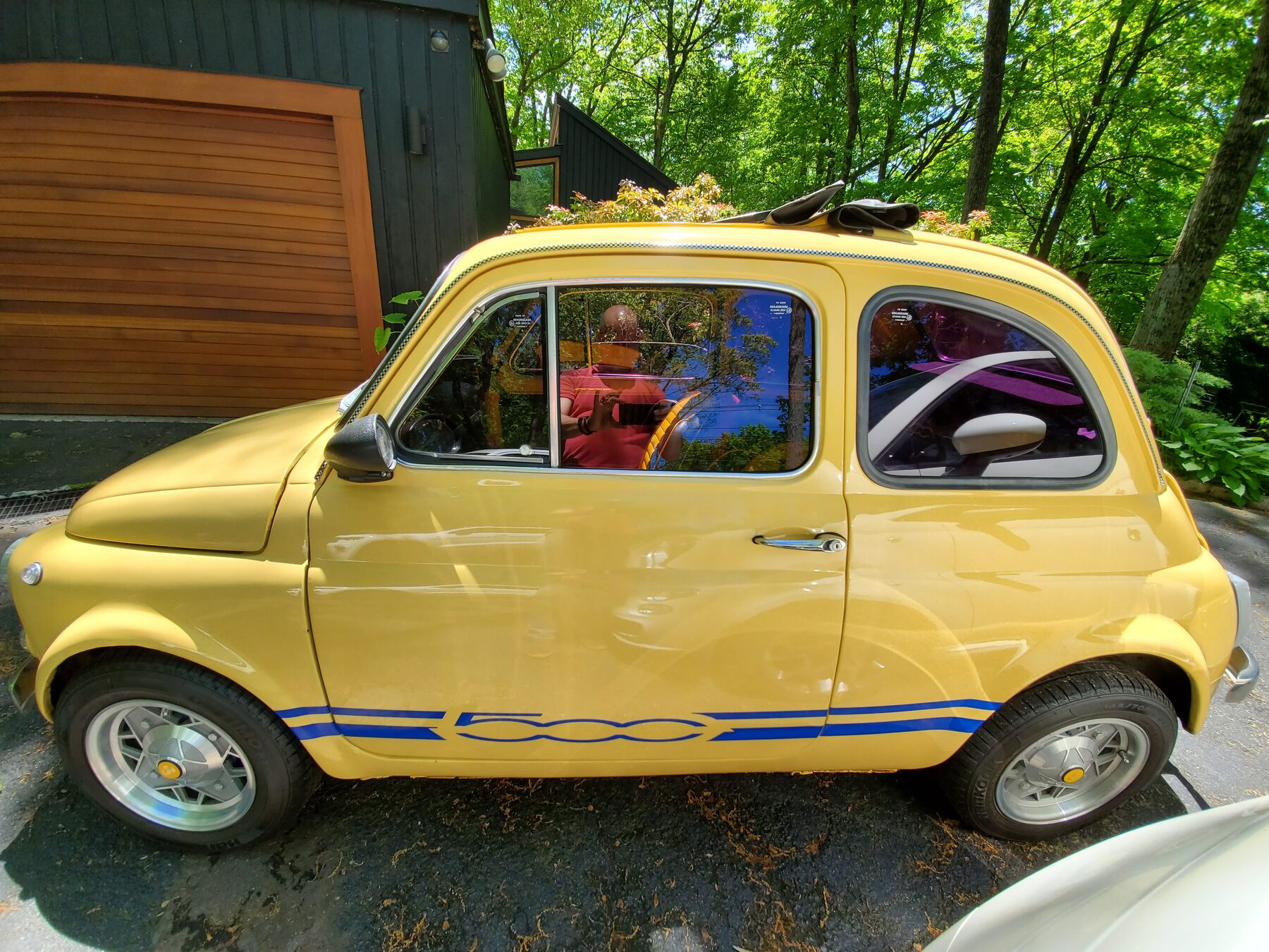 Yellow 1972 Fiat 500 L profile view